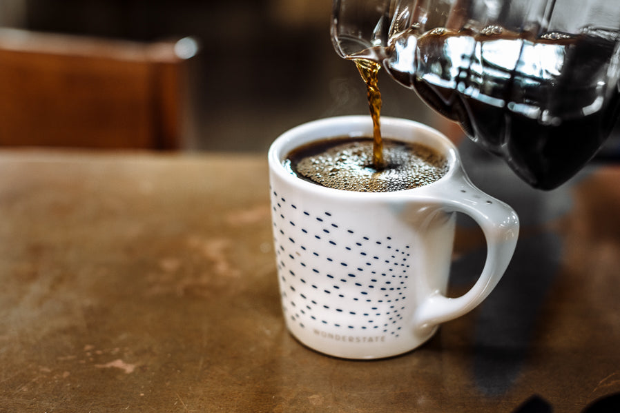 Coffee poured into Wonderstate porcelain coffee mug with