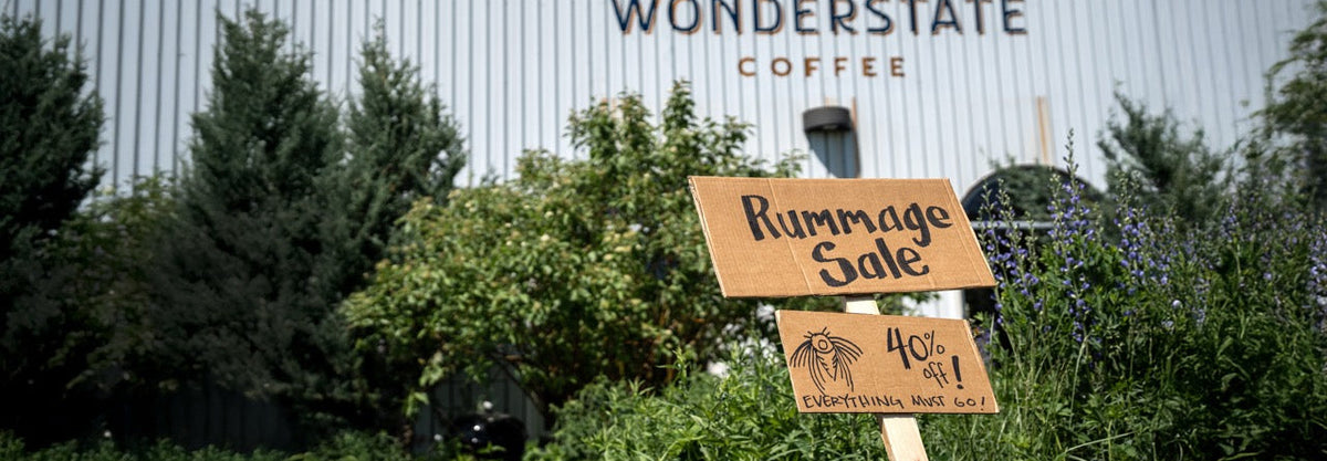 Wonderstate Coffee roastery in the background with a sign printed with Rummage Sale 40% Everything must go